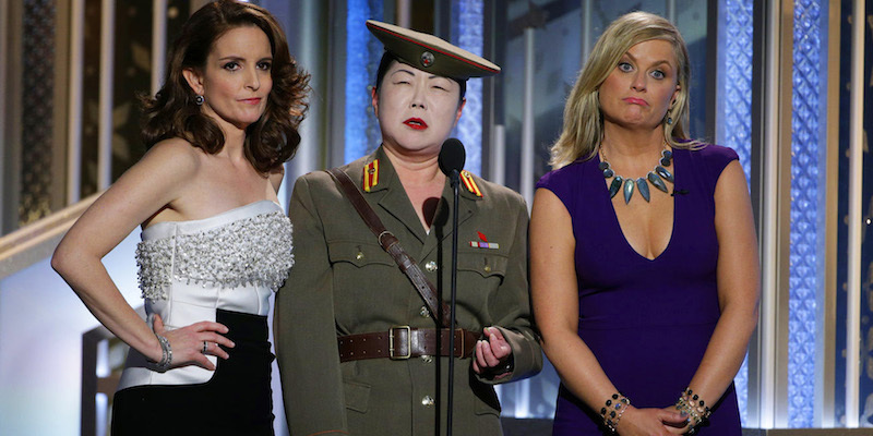 Above: Hosts Tina Fey and Amy Poehler with Margaret Cho during the Golden Globes. Stock Photo.