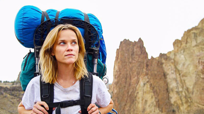 Above: Reese Witherspoon as Cheryl Strayed hiking with her “monster” in “Wild.” Stock Photo.